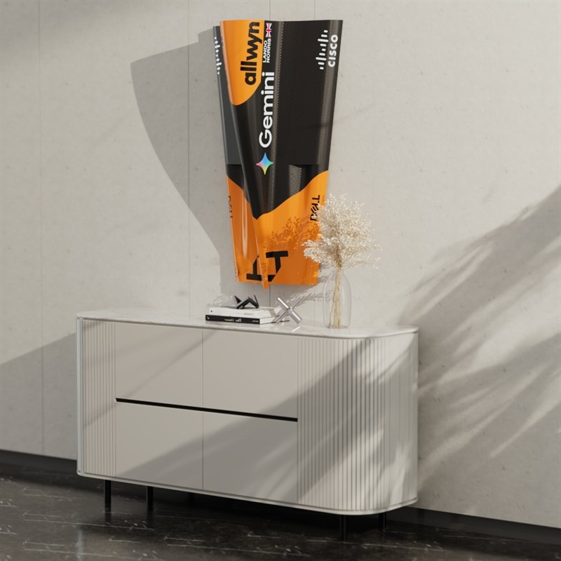A 3D-printed Formula 1 nose cone in Gemini livery mounted above a sideboard.